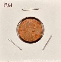 Obverse view of 1961 Lincoln cent in flip
