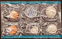 Front view of sealed 1970 proof set showing all coins and mint token