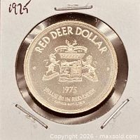 Obverse full view of coin in flip, showing coat of arms and text