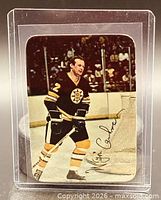 Front of Wayne Cashman O-Pee-Chee glossy insert card in holder