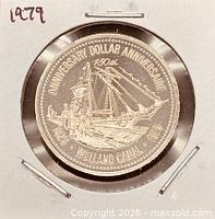 Obverse view of the 1979 Welland Canal 150th Anniversary trade dollar in holder