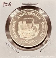 Obverse of coin showing Diamond Anniversary design and dates