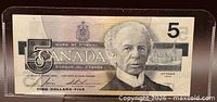 Obverse of note showing denomination, Sir Wilfrid Laurier portrait