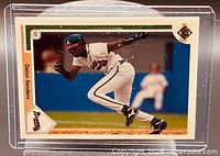 Front of Deion Sanders Upper Deck baseball card in protective case