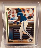Front of 1991 Upper Deck Joe Carter baseball card in holder