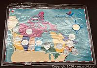 Full view of sealed coin set on Canada map backing showing all coins