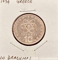 Full coin in holder with handwritten notes