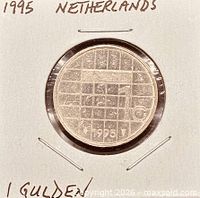 Obverse and reverse views of 1995 Netherlands 1 Gulden coin in cardboard flip