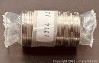 Sealed plastic-wrapped roll of coins labelled 1996 $2