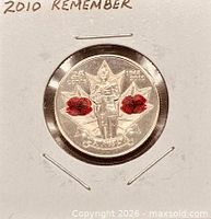 Reverse of 2010 coloured poppy 25-cent coin in 2x2 holder