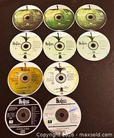 All ten Beatles CDs laid out for count and identification