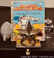 Group shot showing book, star, rocket and robot