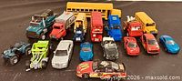 All seventeen vehicles arranged together, mix of cars, trucks and buses