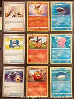 Front view of nine assorted Pokémon cards in binder sleeve