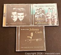 Front covers of all three CD jewel cases visible