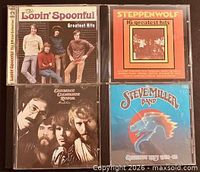 Front covers of all four CD jewel cases