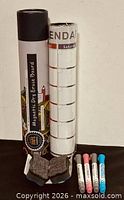 Rolled magnetic dry erase board with tube, markers and erasers