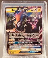 Front view of Tapu Koko GX SM50 card displaying artwork, text, and condition