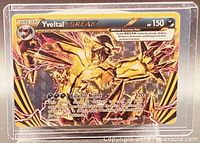 Front view of Yveltal BREAK card showing artwork, card number, stats