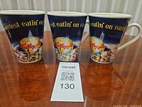 Front view of three Kellogg's mugs showing globe logo and mascots