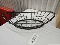 Top view of oval wire metal fruit basket showing grid pattern and finish