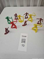 All ten plastic Western figurines grouped on table