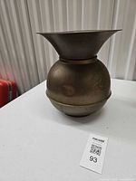 Full view of brass spittoon showing overall form and patina