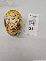 Closed egg showing exterior farm scene graphics