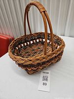 Side view showing basket shape, weave, handle, bead details