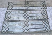 Three matching leaded glass panels laid out side by side