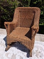 Front-angled view of woven wicker rocking chair showing overall form