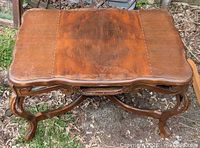 top view showing walnut veneer surface and scalloped edges