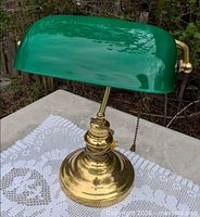 Full lamp showing brass base and green cased glass shade