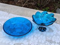 Top view of both cobalt blue pressed glass dishes showing overall form and color