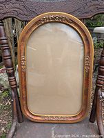 Full front view of the wooden frame showing overall condition and decoration