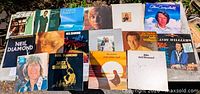 All 16 LPs laid flat showing cover art