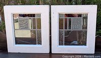 Front view of both stained glass windows in frames