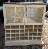 Front view showing glass doors, cubby grid, quartz top
