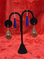 Both earring pairs on stand showing overall style and size