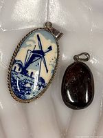 Front view of both sterling pendants on white background