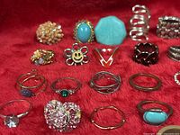 Front grouping of assorted rings on red fabric