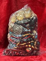 Front view of sealed bag showing mixed jewellery pieces