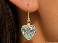 Earring worn on ear showing size and drop length
