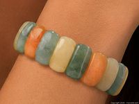 Bracelet worn on wrist showing multicolour aventurine beads