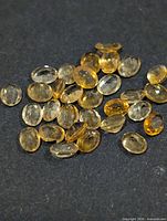 Cluster of oval yellow citrine gemstones