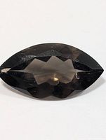 Top view of faceted marquise smokey quartz showing overall shape and colour
