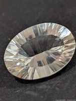 Top view showing oval shape and facet pattern of quartz gemstone