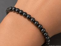Bracelet worn on wrist showing bead size and finish