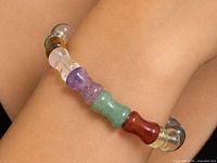 Bracelet on wrist showing variety of gemstone beads and flexibility