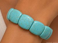 Bracelet worn on wrist showing color and bead shape